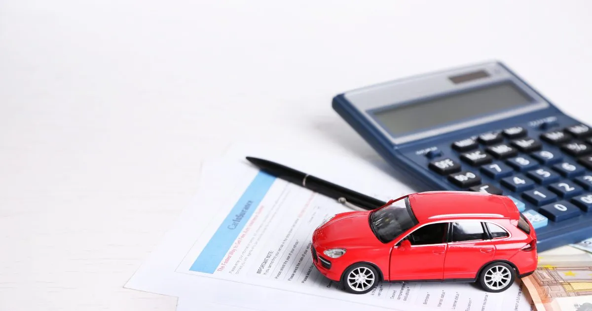 Car insurance concept with insurance form ,Miniature car, calculator and pen