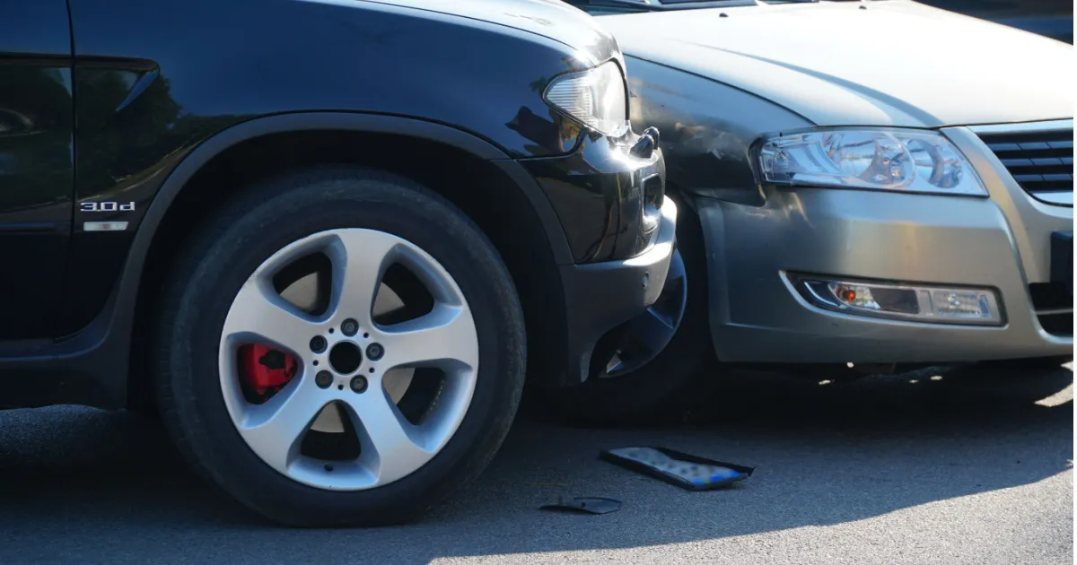 Traffic accident. Wrecked car. Car crash accident on street, damaged automobiles after collision in city.
