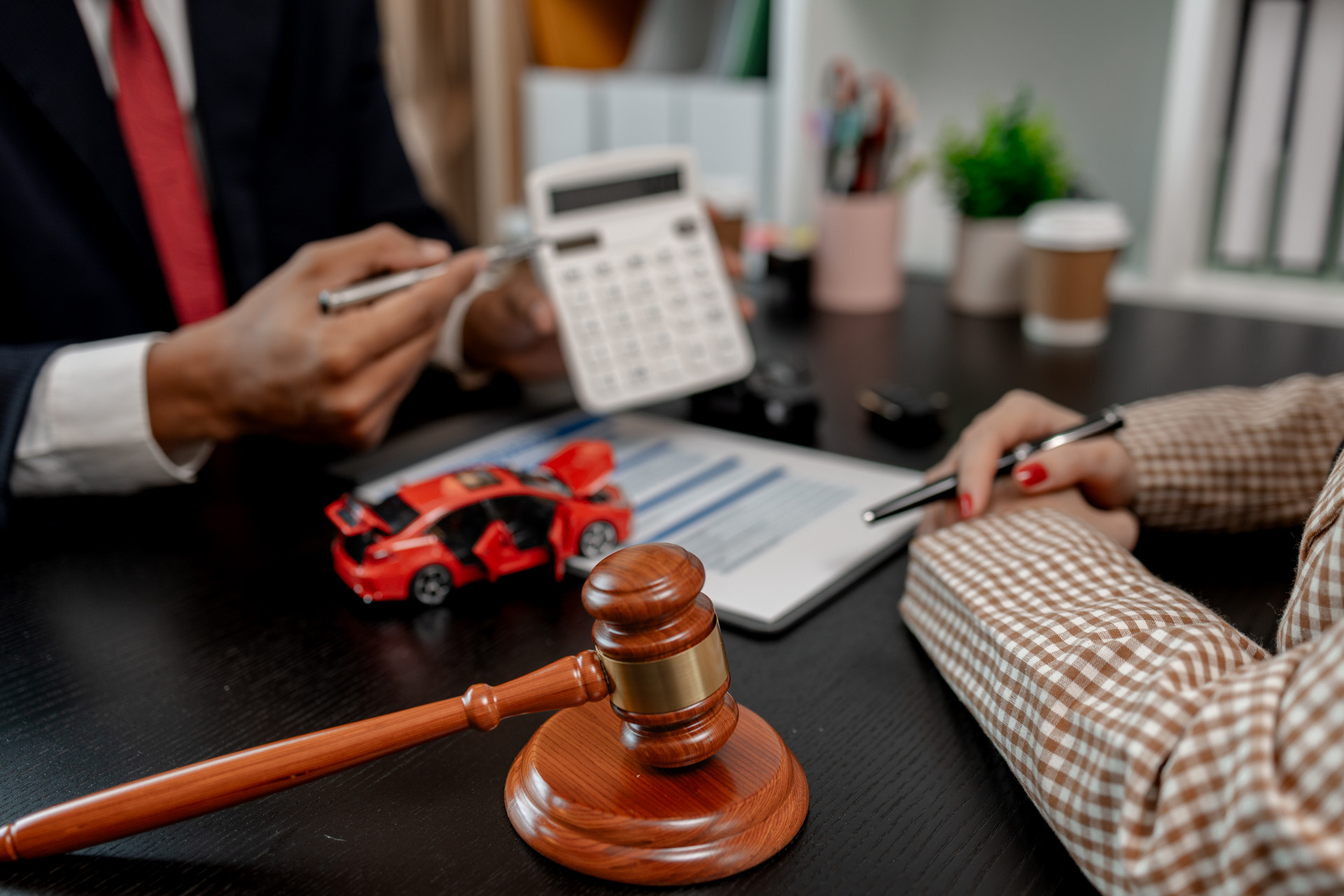 a lawyer is explaining the details of a car accident settlement